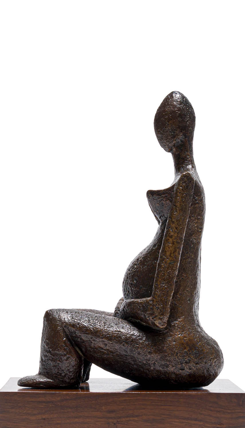 A statue of a pregnant woman sitting on a wooden base. Description generated by AI
