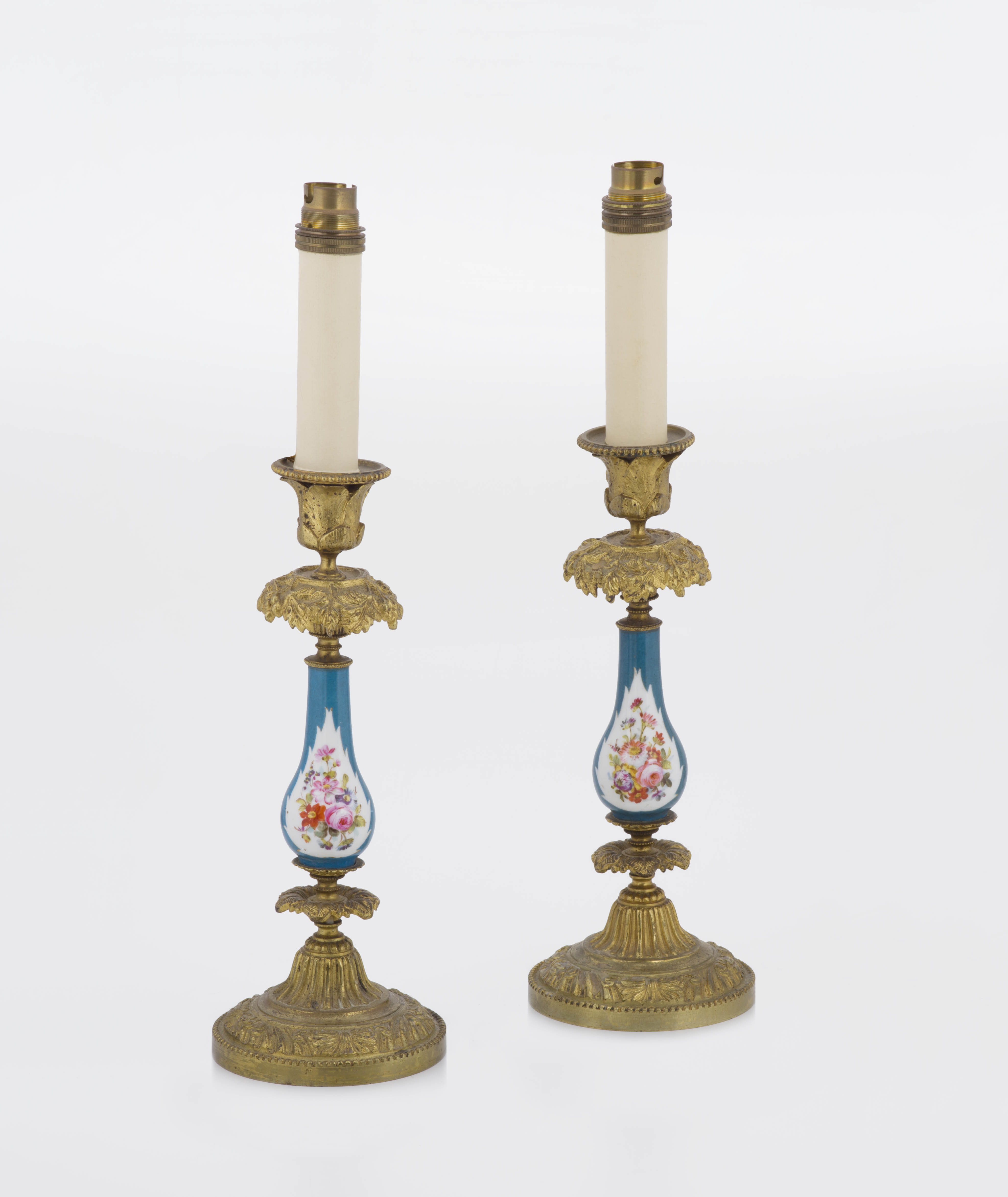 A pair of porcelain gilt-metal mounted table lamps, late 19th century