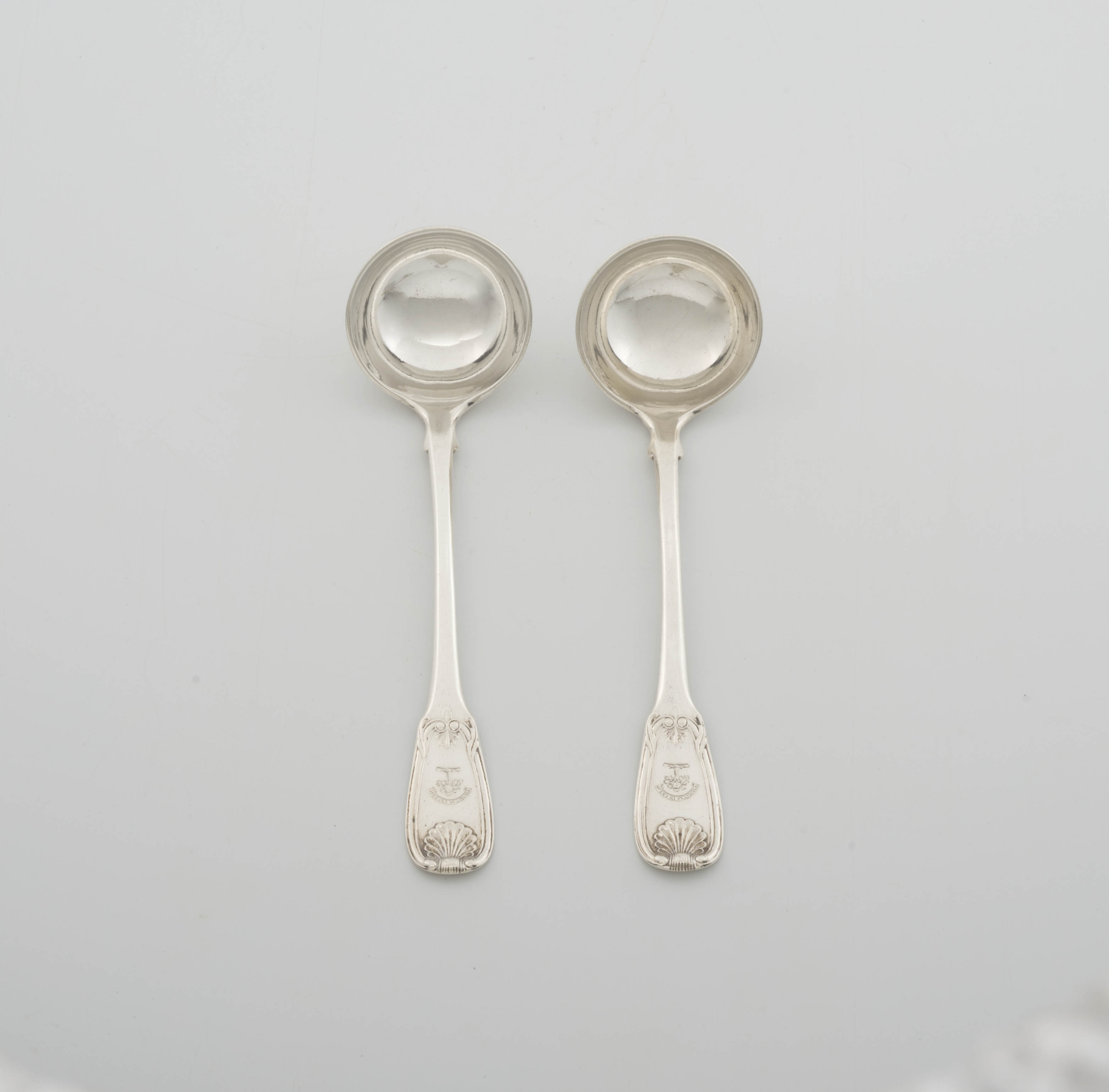 A pair of George III silver Fiddle and Shell pattern sauce ladles, Robert Gray & Son, Edinburgh, 1814