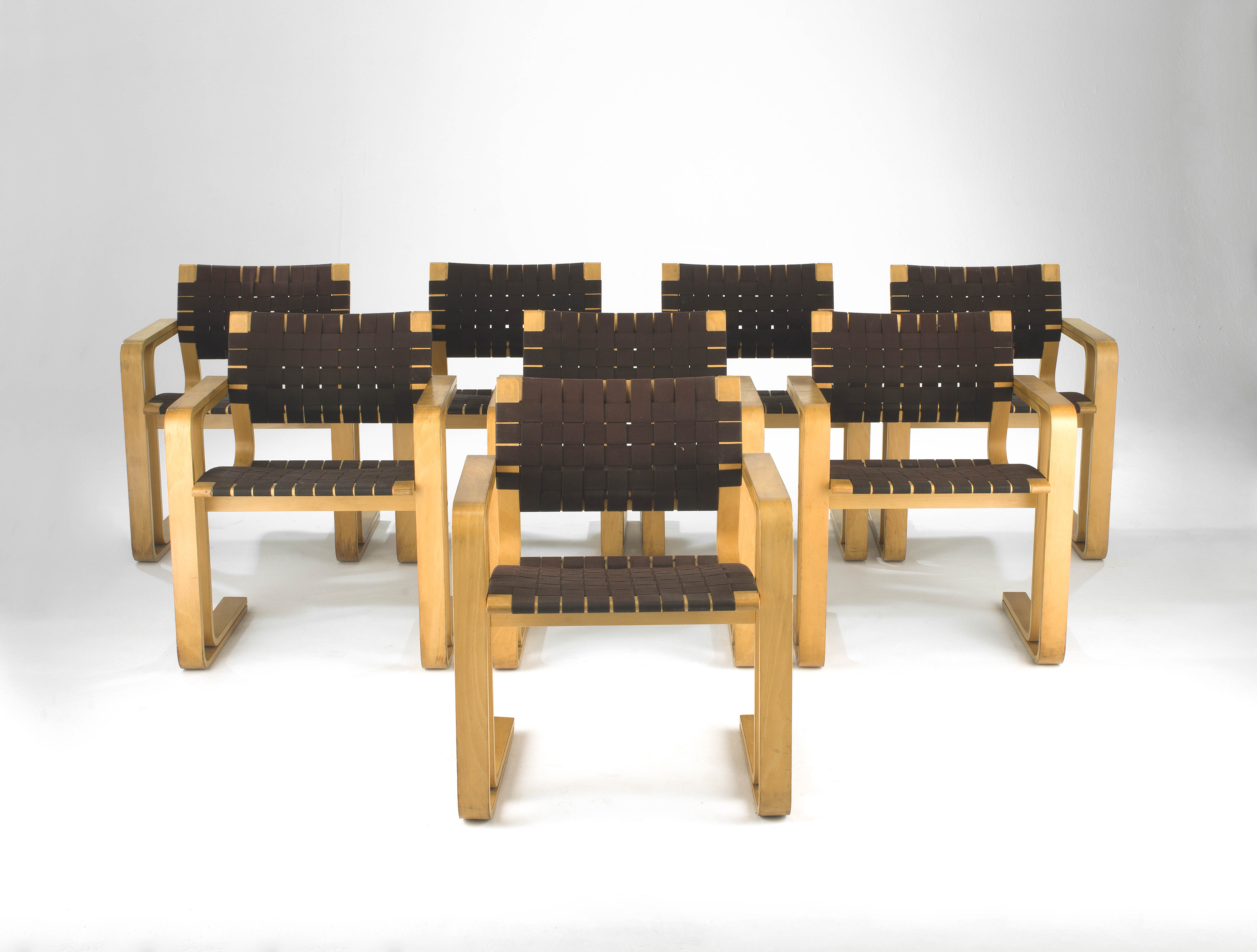 Eight Danish Magnus Olesen armchairs, designed by Rud Thygesen and Jonny Sørensen