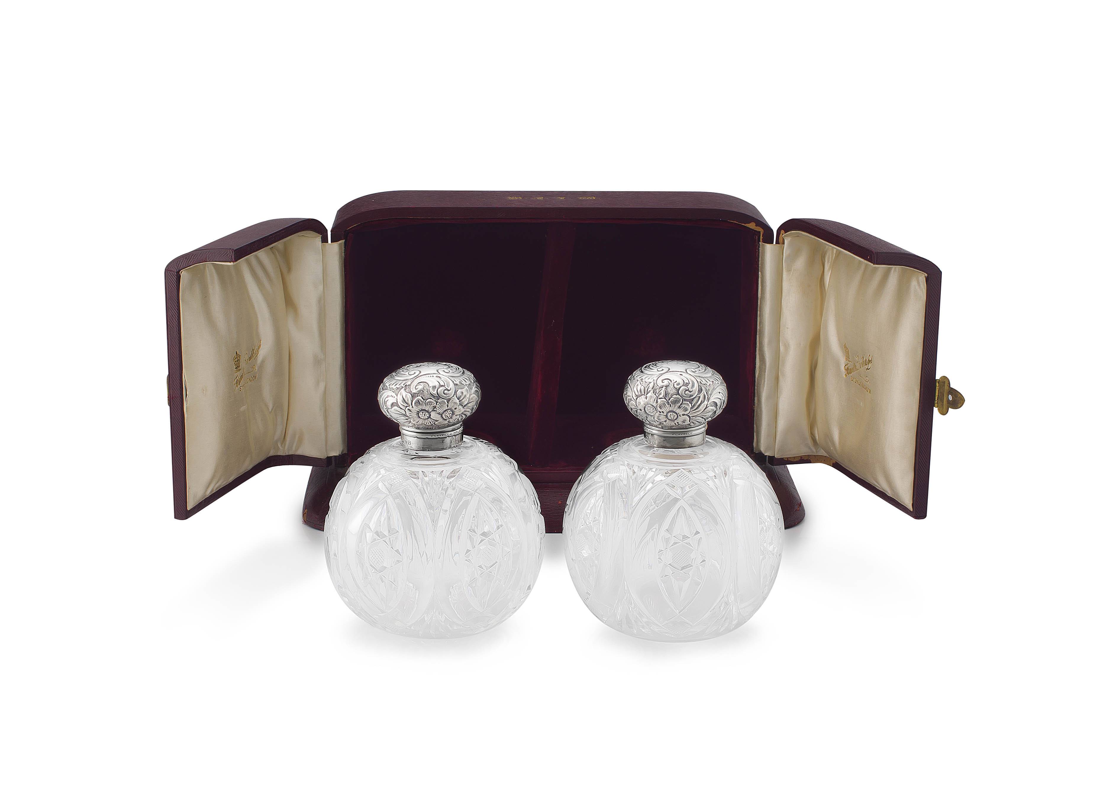 A pair of Victorian silver-mounted and cut-glass scent bottles, retailed by Flavelle Brothers Ltd, Sydney & London, Chester, 1899