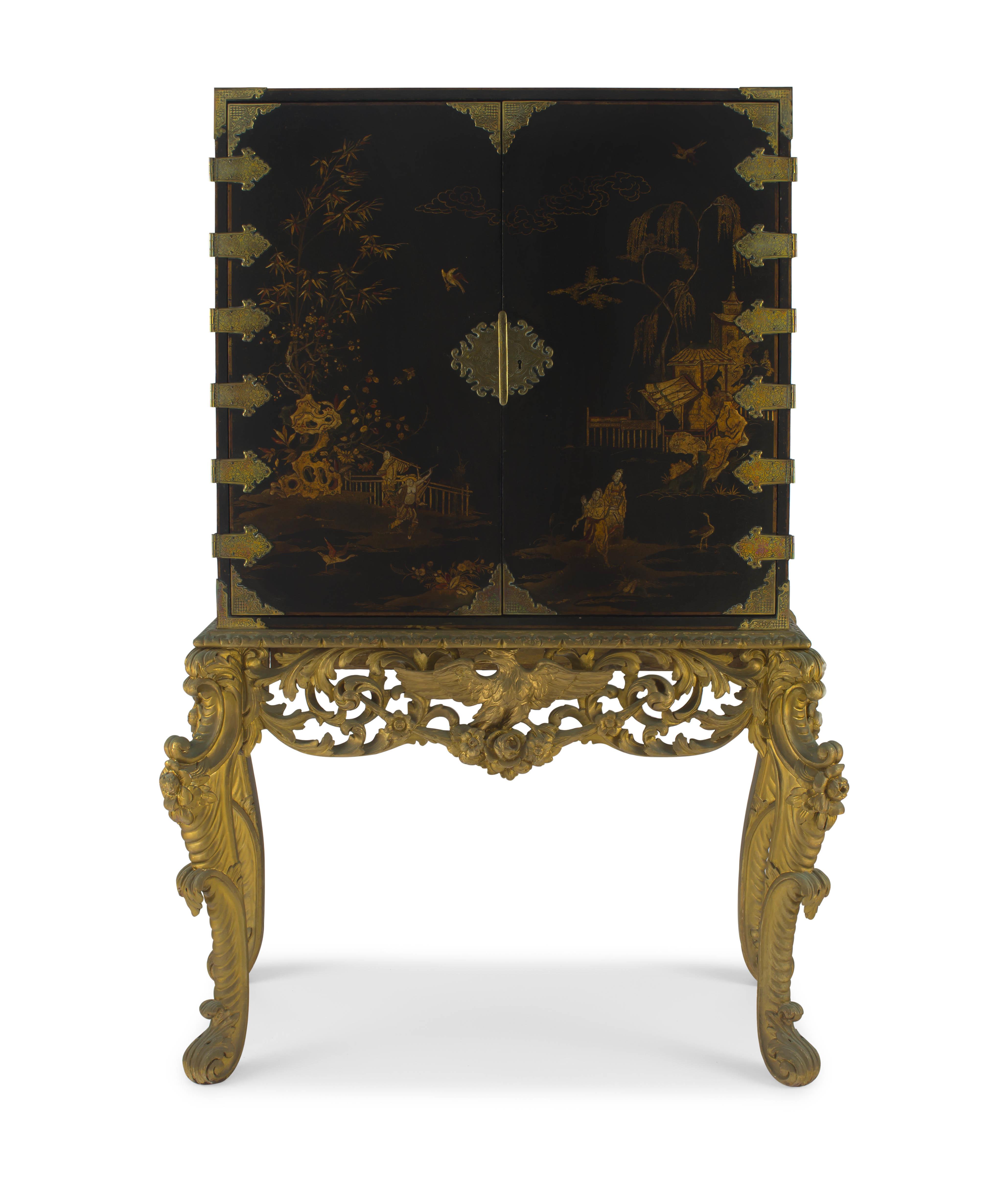 A black japanned and chinoiserie decorated brass-mounted cabinet-on-stand, 19th century