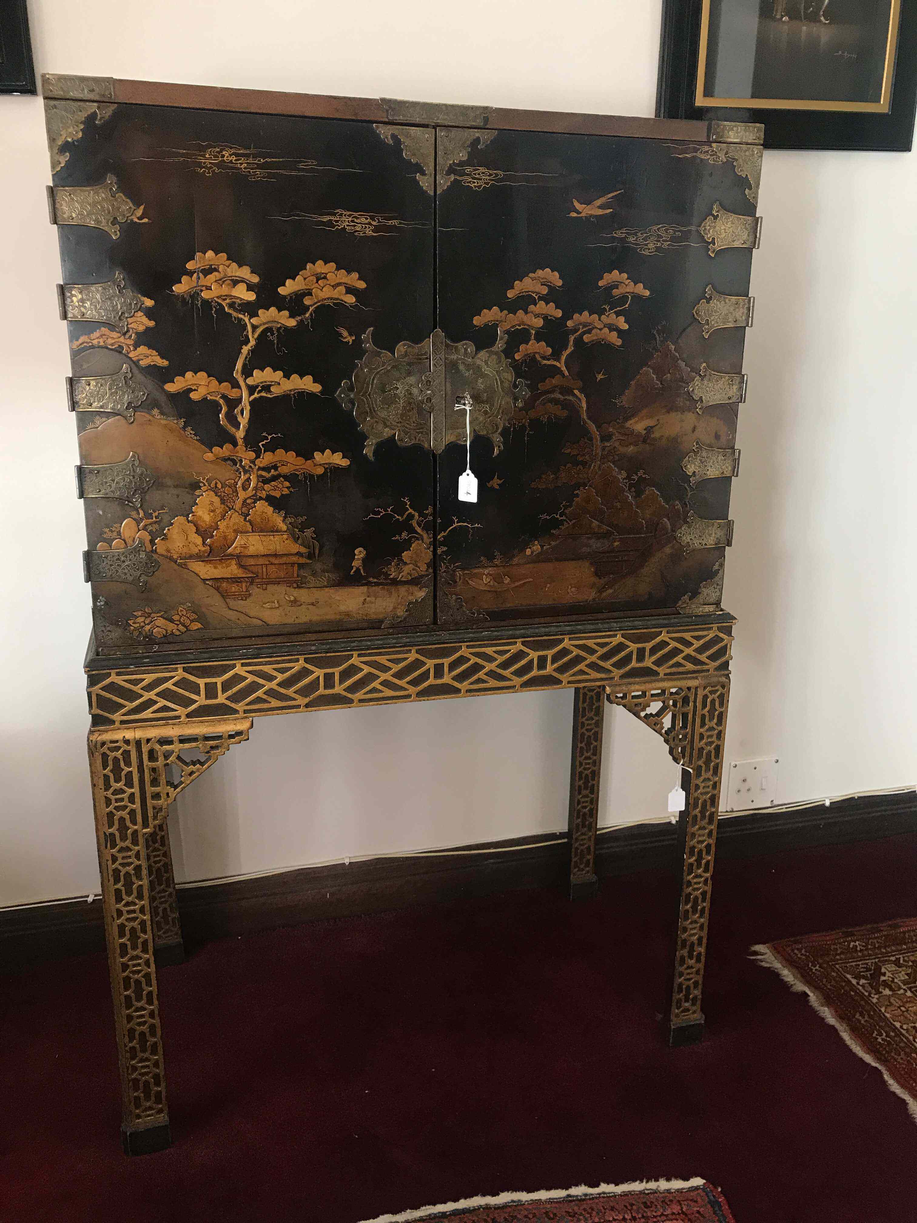 A black lacquered and gilt-metal-mounted cabinet-on-stand, 18th/19th century