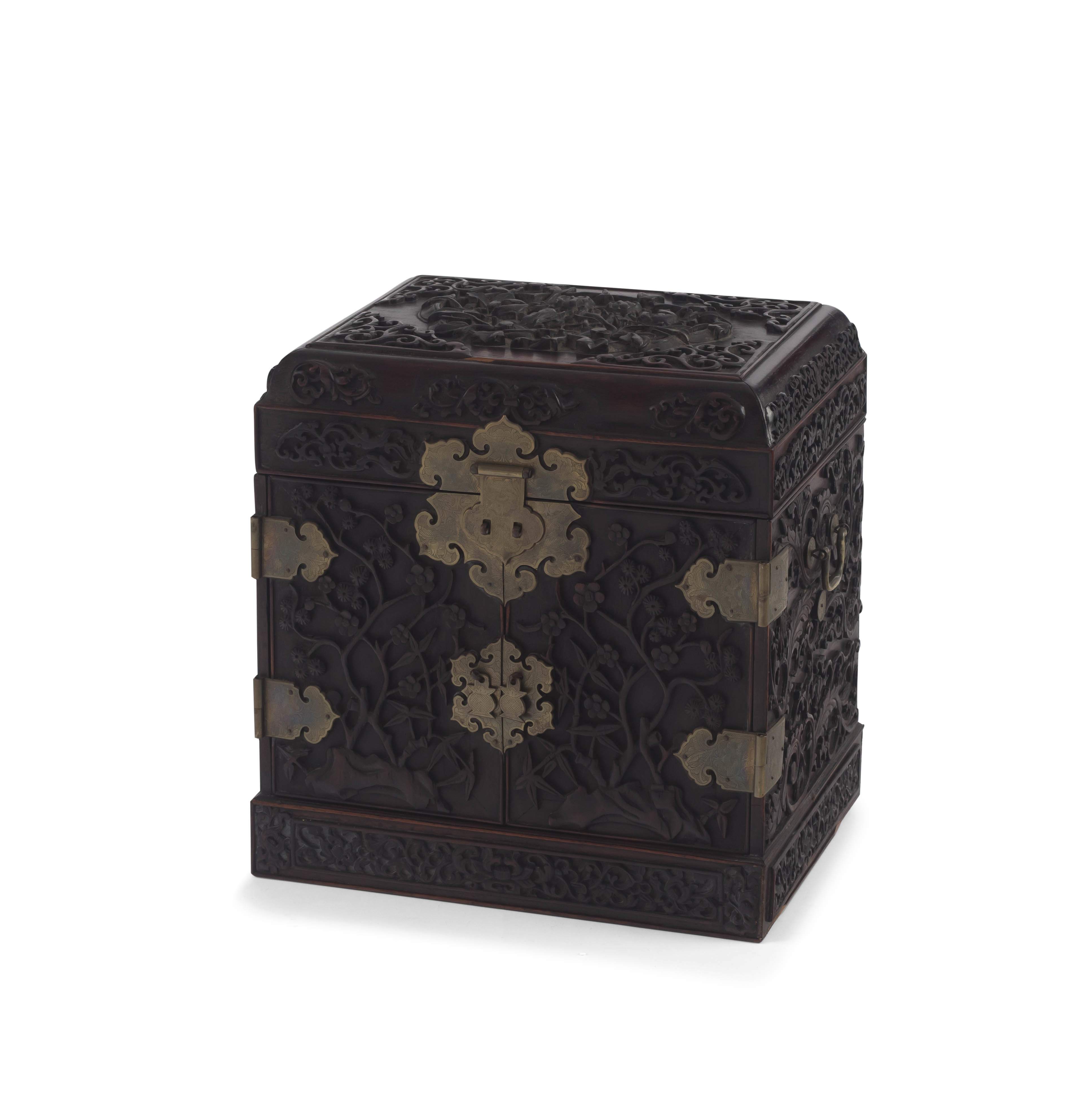 A Chinese hardwood and brass metal-mounted cabinet, late 19th/early 20th century