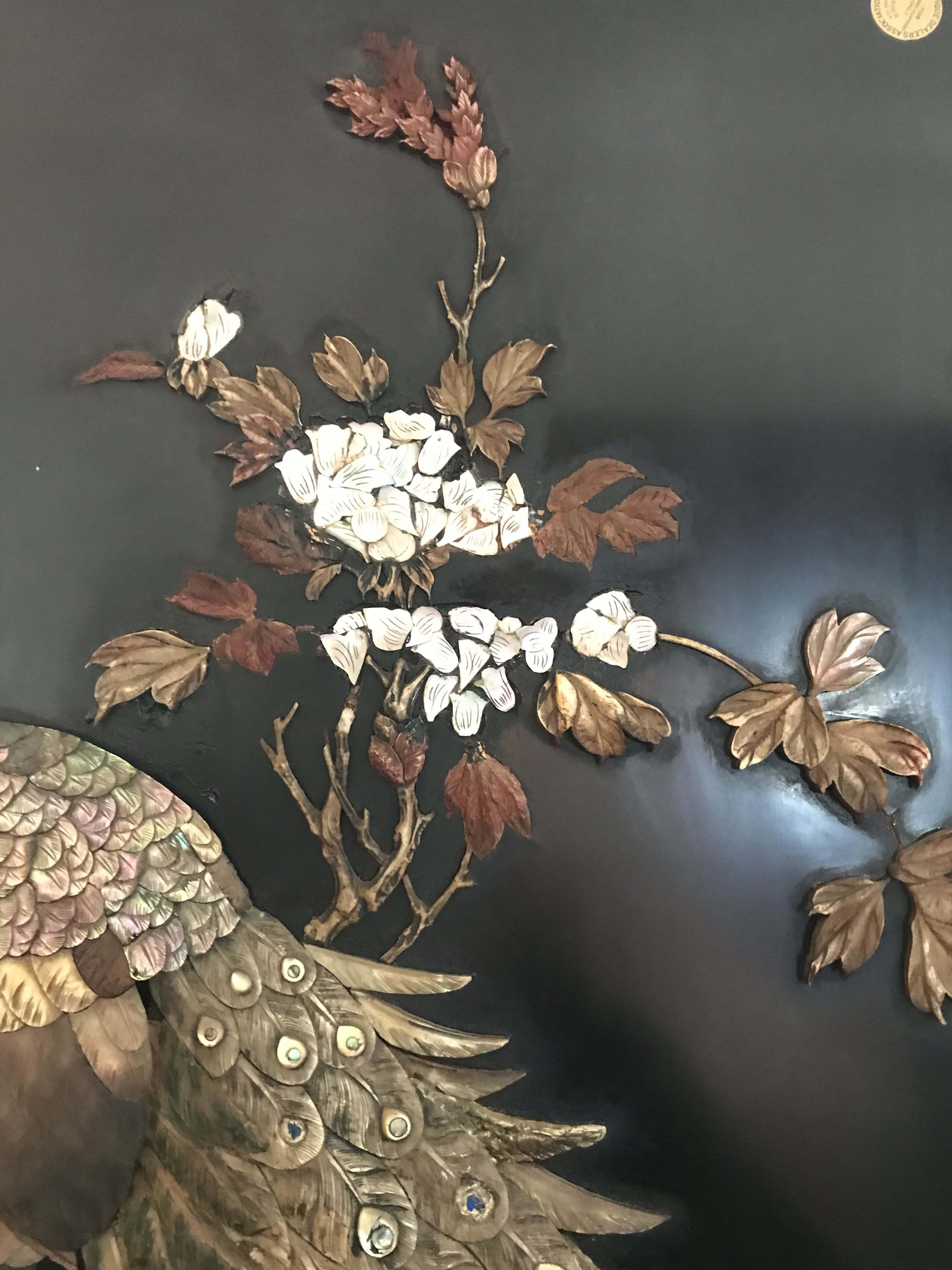 A Japanese hardwood, lacquered, ivory and Shibayama inlaid panel, late Meiji period