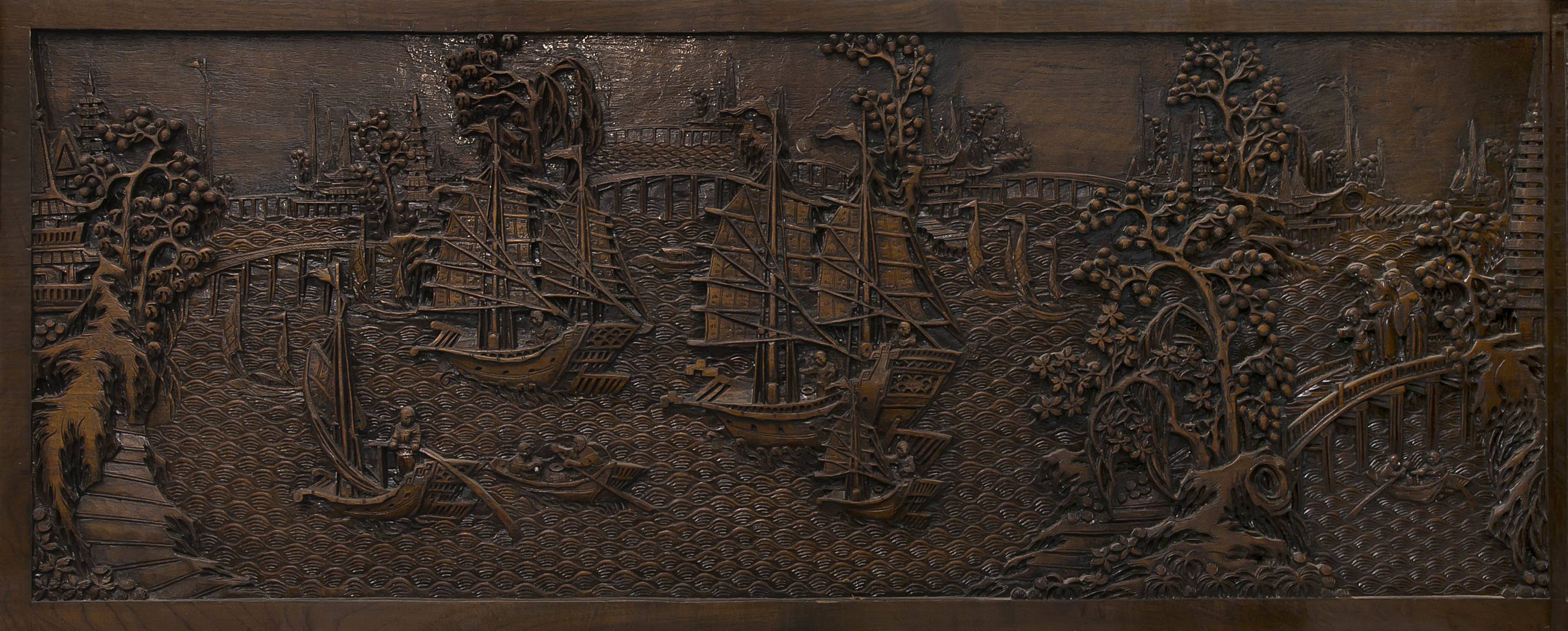 A set of seven Chinese Export carved teak panels, late 19th/early 20th century