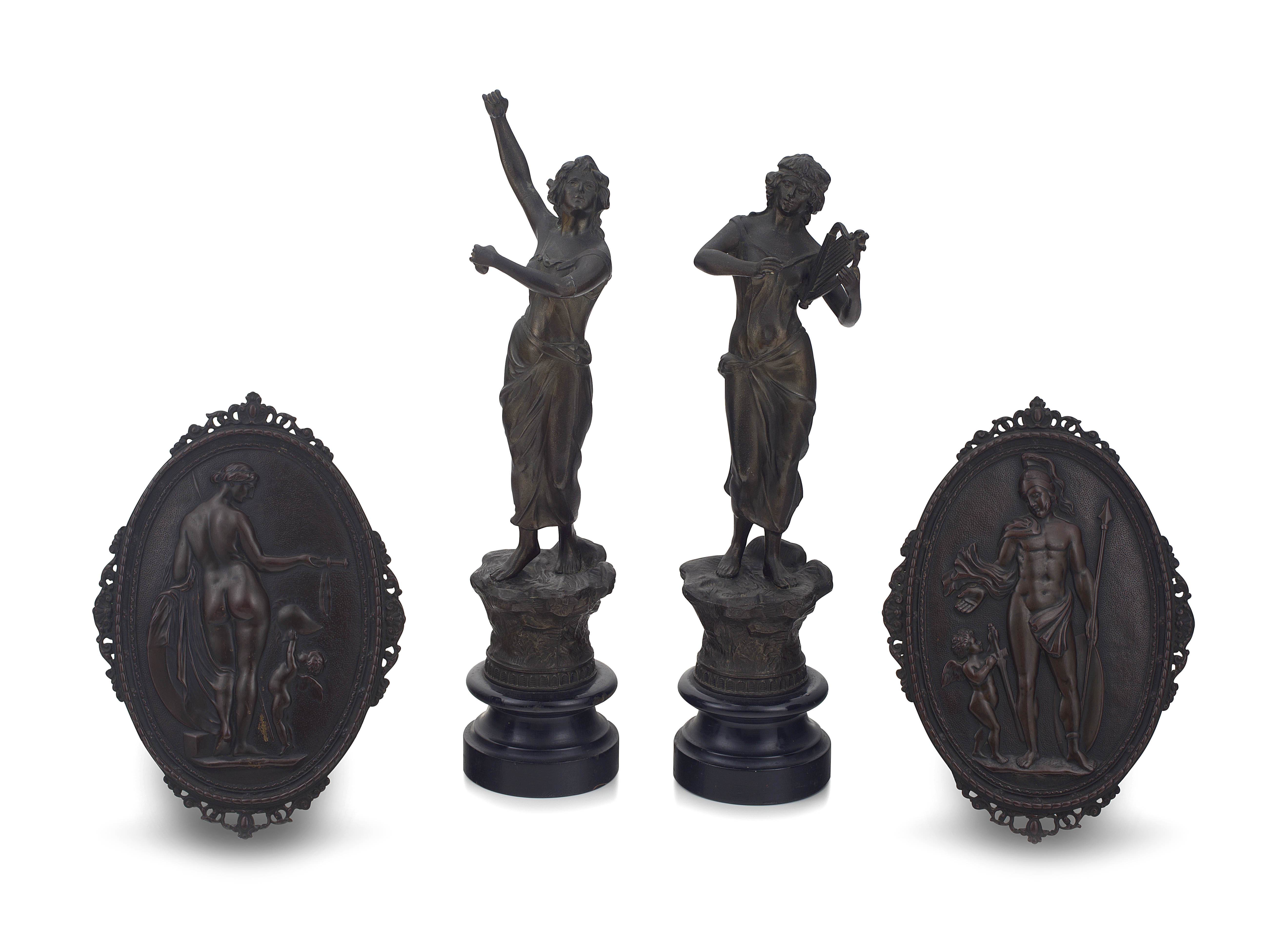 A pair of allegorical patinated bronze wall plaques, 19th/20th century