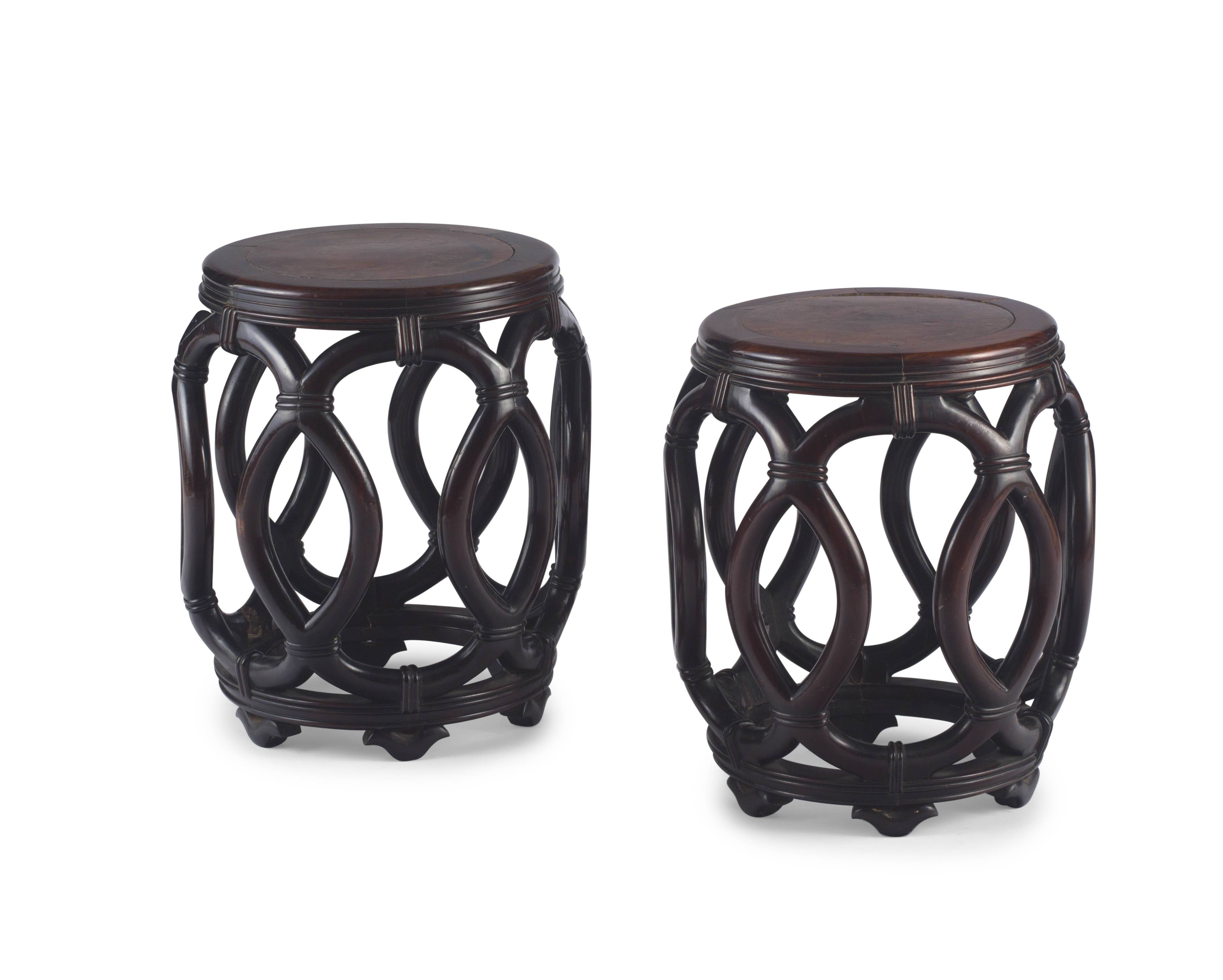 A pair of Chinese hongmu and walnut inlaid drum stools, Qing Dynasty, 19th century