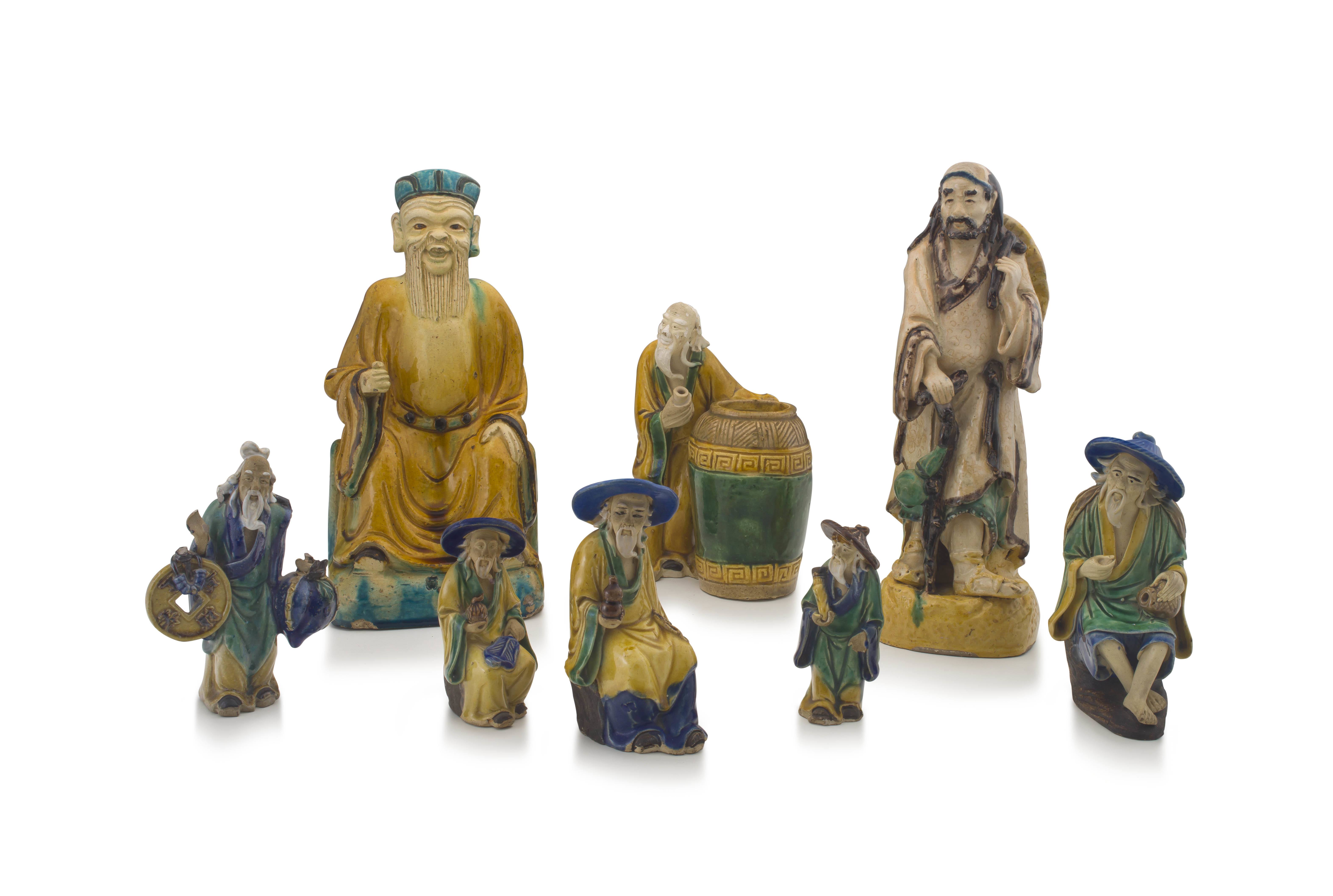 A group of eight Chinese sancai-glazed stoneware figures of sages and tradesmen, 20th century
