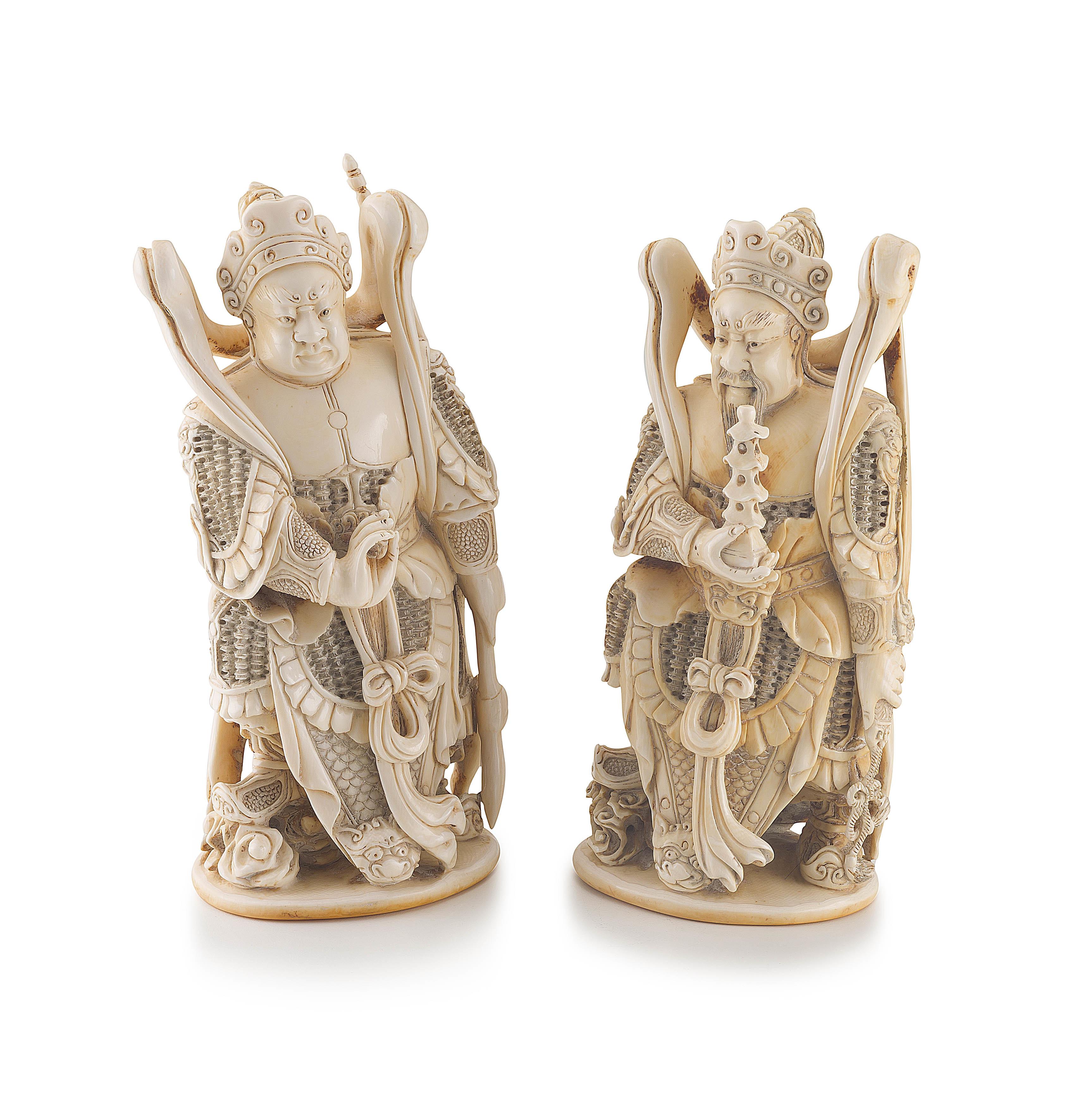 A pair of Chinese carved ivory figures of warriors, Qing Dynasty, 19th century