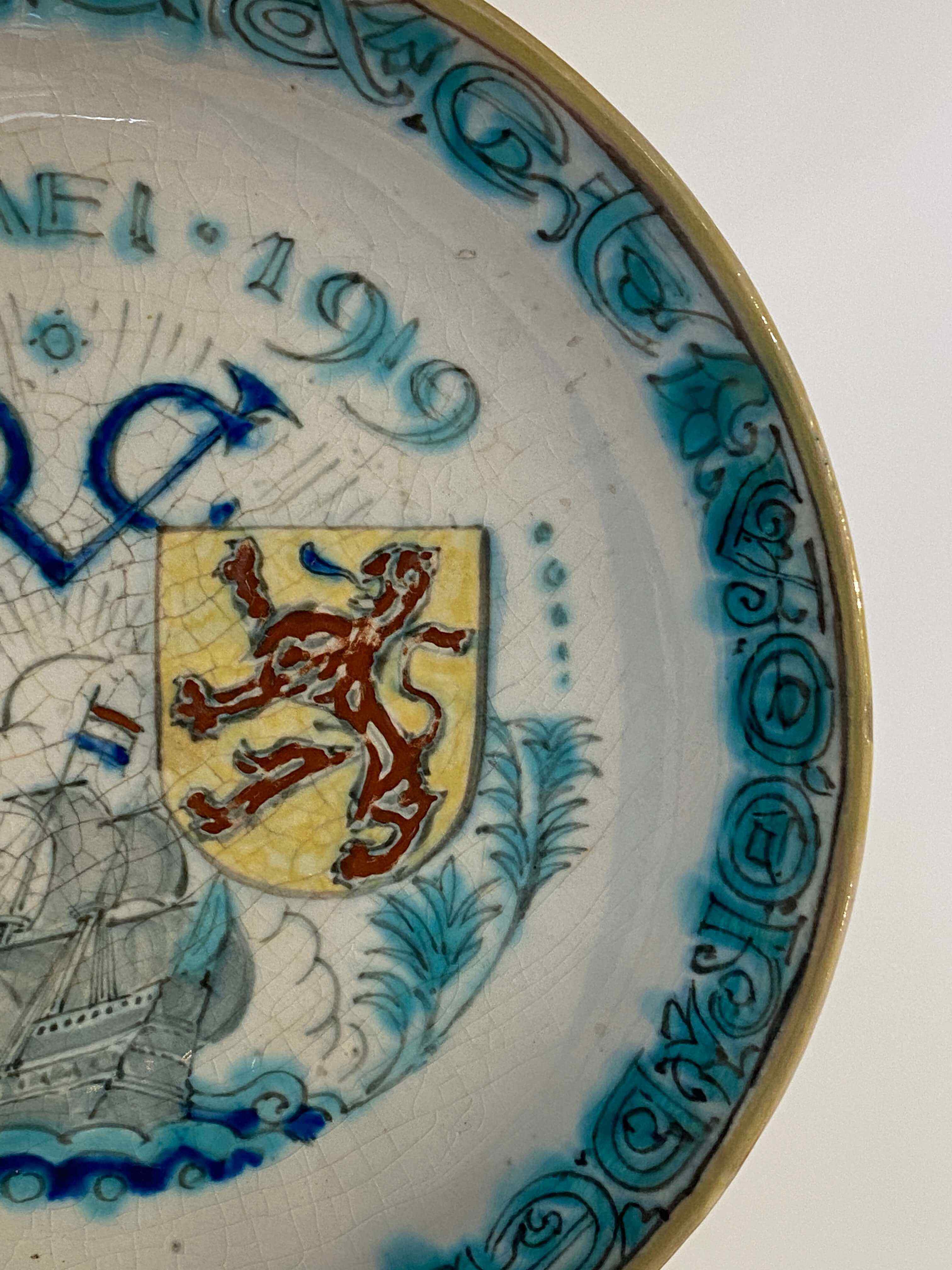 A Royal Delft de Porceleyne Fles earthenware polychrome Commemorative VOC plate, 1619-1919