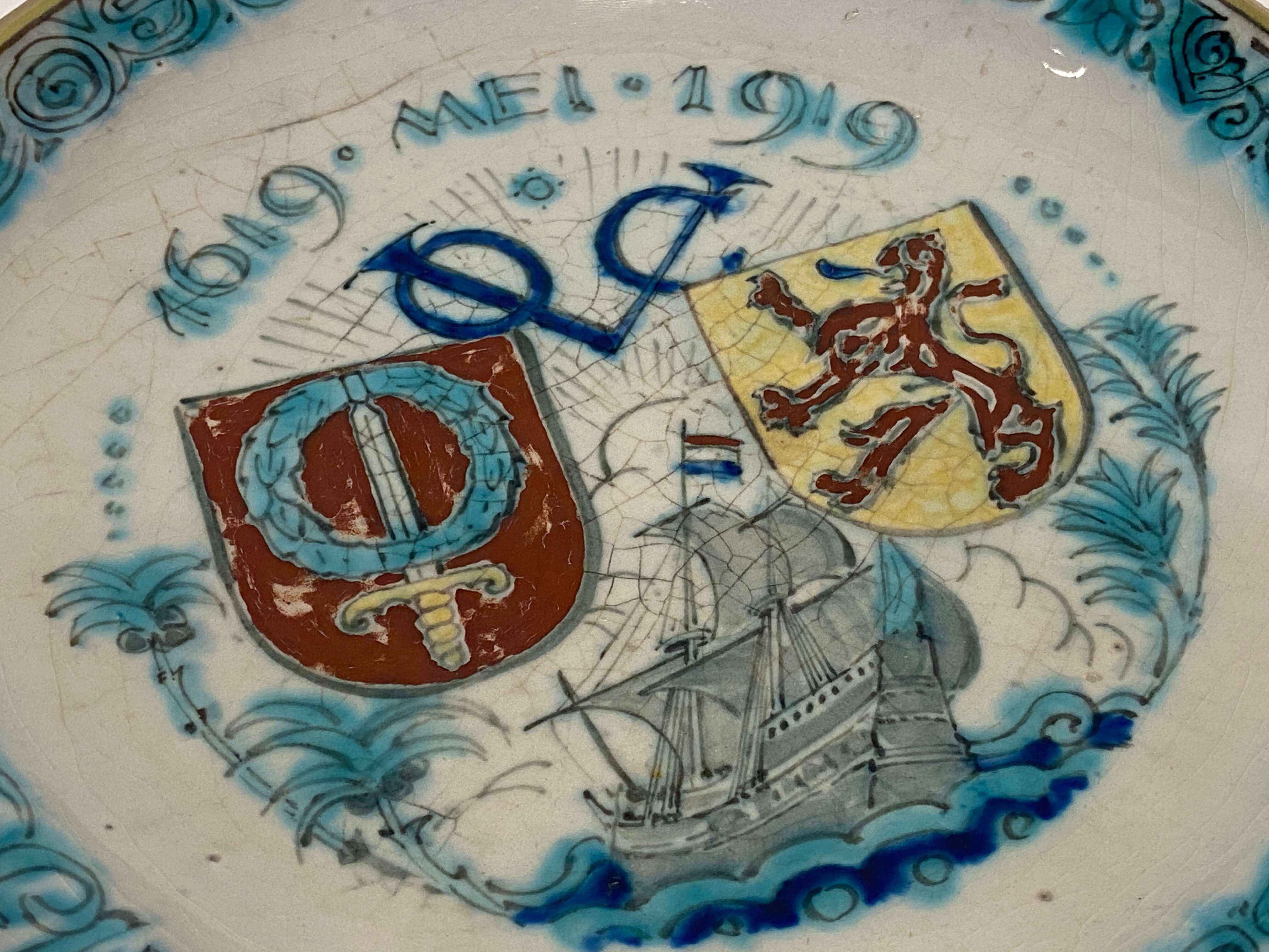 A Royal Delft de Porceleyne Fles earthenware polychrome Commemorative VOC plate, 1619-1919