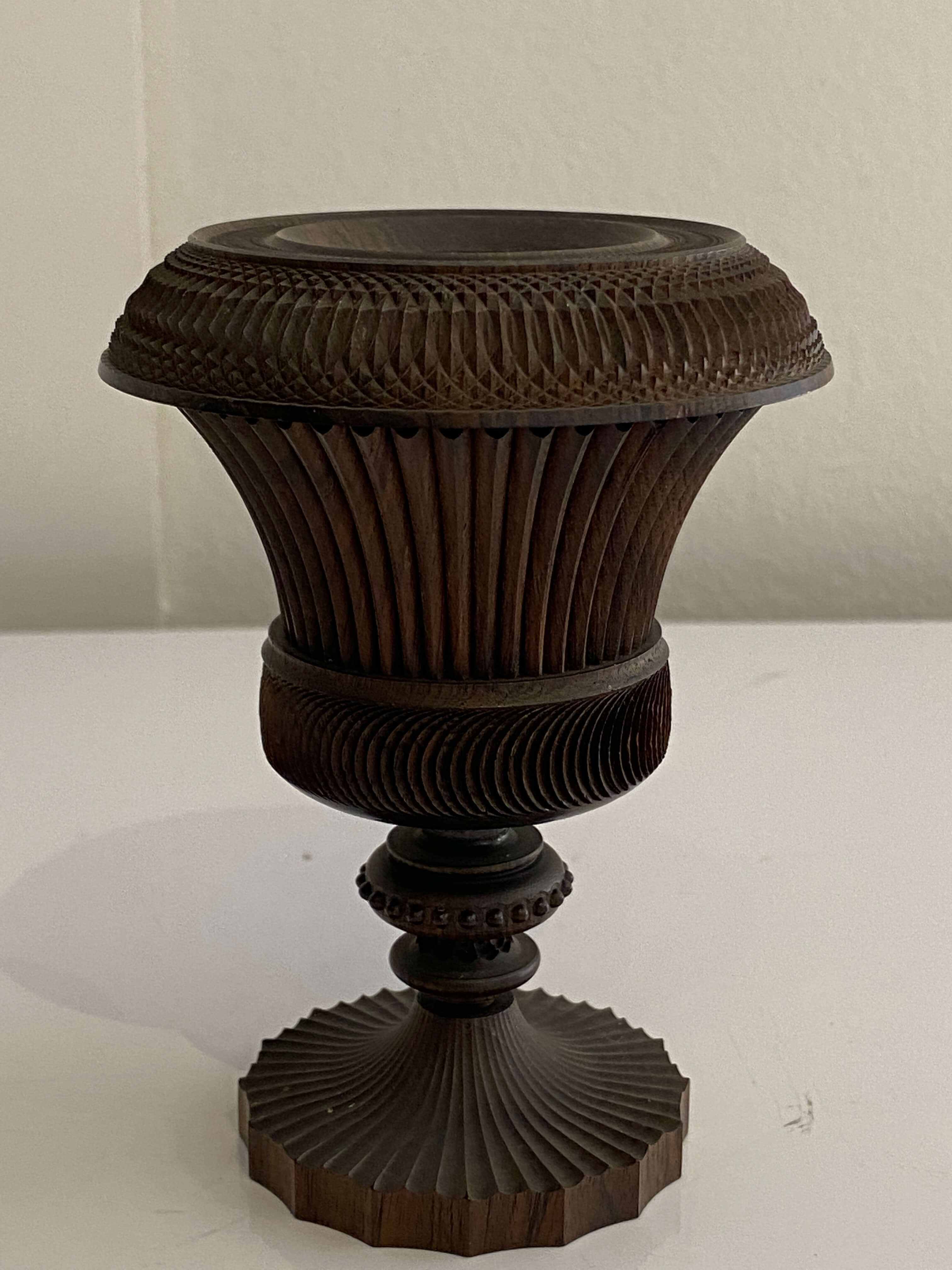 A treen lignum vitae spill vase, 19th century
