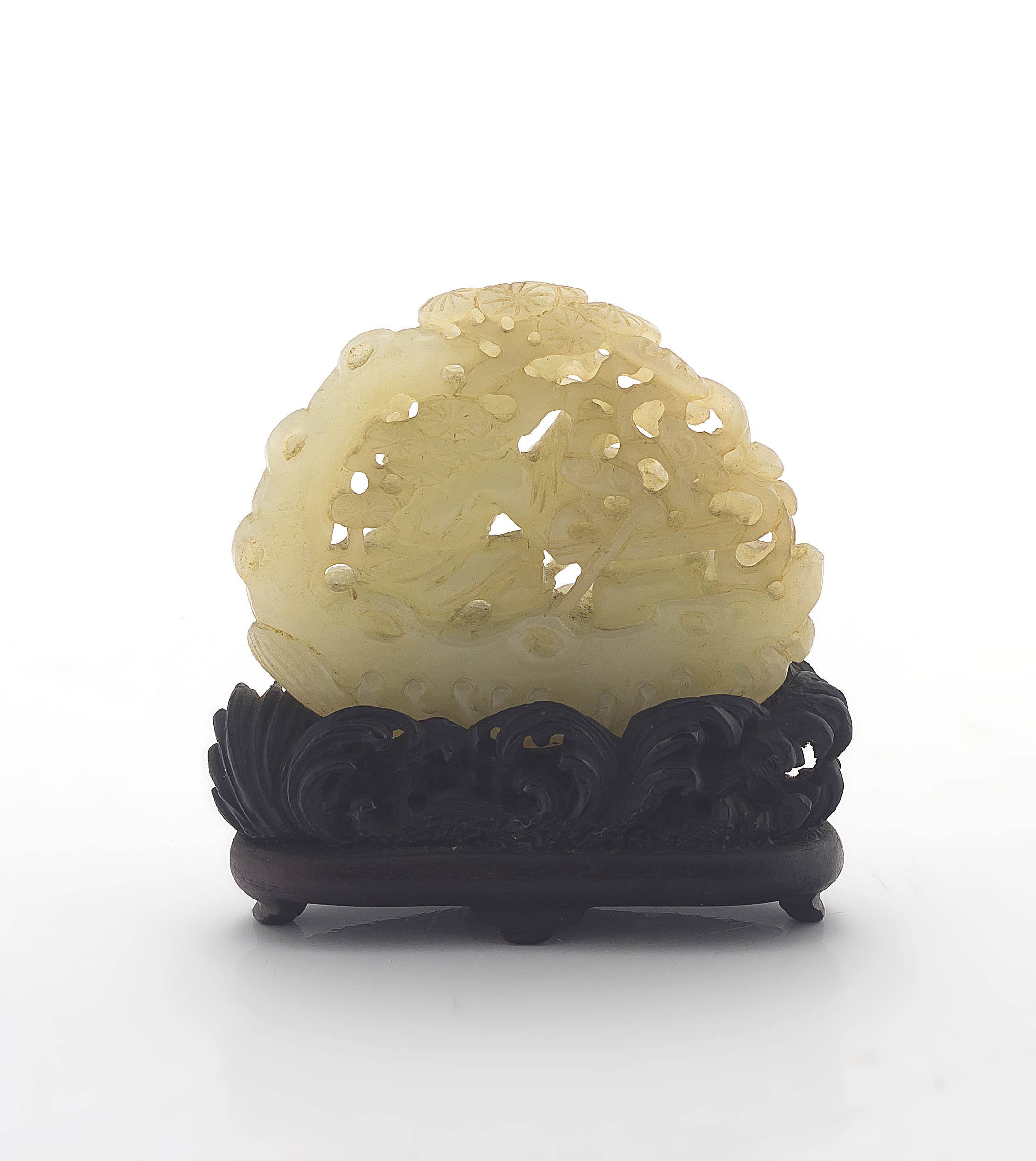 A Chinese jade pierced carving of a small boy in his boat, late 19th century