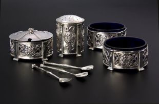 A silver cruet set, Omar Ramsden and Alwyn Carr, London, 1908 - 1911