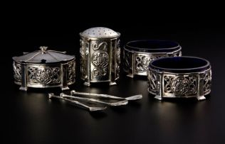 A silver cruet set, Omar Ramsden and Alwyn Carr, London, 1908 - 1911