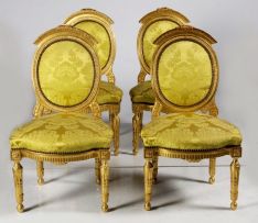A set of four Louis XVI style giltwood side chairs