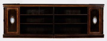 A pair of Victorian ebonised, bird's-eye maple and porcelain mounted open bookcases