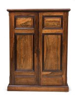 A colonial rosewood and ebonised book cabinet, possibly Dutch, 19th century