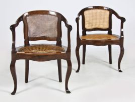 A pair of Cape stinkwood and caned tub chairs, early 19th century