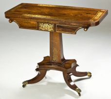 A Regency rosewood and brass-inlaid card table