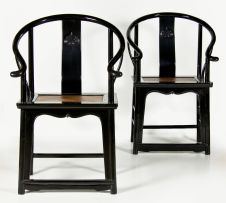 A pair of Chinese black lacquer horse-shoe chairs, 19th century