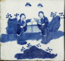 A Chinese black lacquer and porcelain-mounted four-fold screen, 19th century