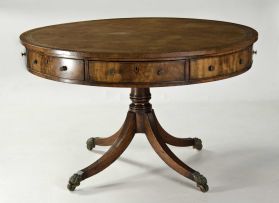 A George III style mahogany library drum table