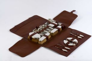A George V gentleman's leather-cased travelling set, FH Adams & Co, Birmingham, 1928 - 1932