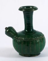 A green-glazed earthenware kendi, 18th century
