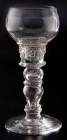 A hollow-stemmed baluster mead glass, early 18th century