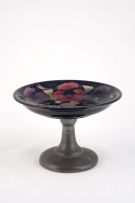 A Tudric pewter mounted Moorcroft 'Pansy' pattern tazza, 1920s