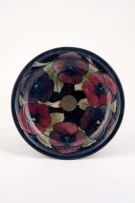 A Tudric pewter mounted Moorcroft 'Pansy' pattern tazza, 1920s