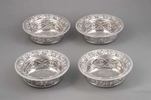 A set of four George III silver decanter stands, Benjamin Smith II and James Smith III, London, 1811