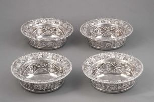 A set of four George III silver decanter stands, Benjamin Smith II and James Smith III, London, 1811