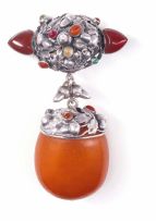 An Arts and Crafts amber, multi-gem-set and silver brooch/pendant, circa 1900
