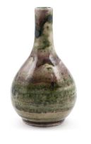 A Chinese copper-red and mottled green bottle vase, Qing Dynasty, 18th century