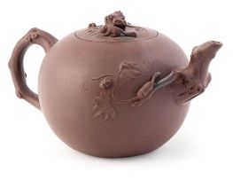 A Chinese Yixing stoneware teapot and cover, Qing Dynasty, 19th century