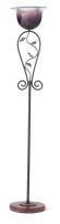 A wrought-iron and glass floor lamp