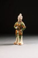 A Chinese Sancai-glazed figure of a warrior, Tang Dynasty