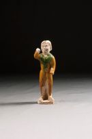 A Chinese Sancai-glazed figure of an attendant, Tang Dynasty
