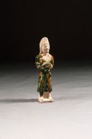 A Chinese Sancai-glazed figure of an attendant, Tang Dynasty
