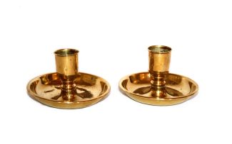 A pair of brass travelling candlesticks, 19th century