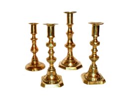 A pair of brass candlesticks, 19th/20th century