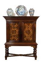 A Colonial rosewood, satinwood, teak and parquetry cupboard-on-stand, 18th century