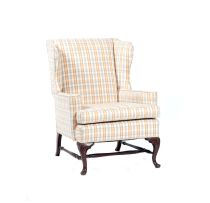 A George II style upholstered and mahogany wingback armchair