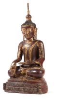 A Cambodian or Burmese carved lacquer and gilt figure of Buddha, late 18th century