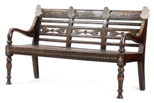 An Indonesian teak and brass-mounted bench