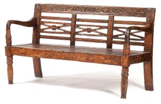 An Indonesian teak and brass-mounted bench