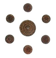 A group of ten Indian carved teak ceiling roses